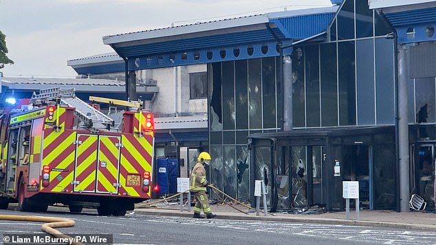 Fire fighters at the scene where the blaze broke out at Larne Leisure Centre following vandalism at the facility