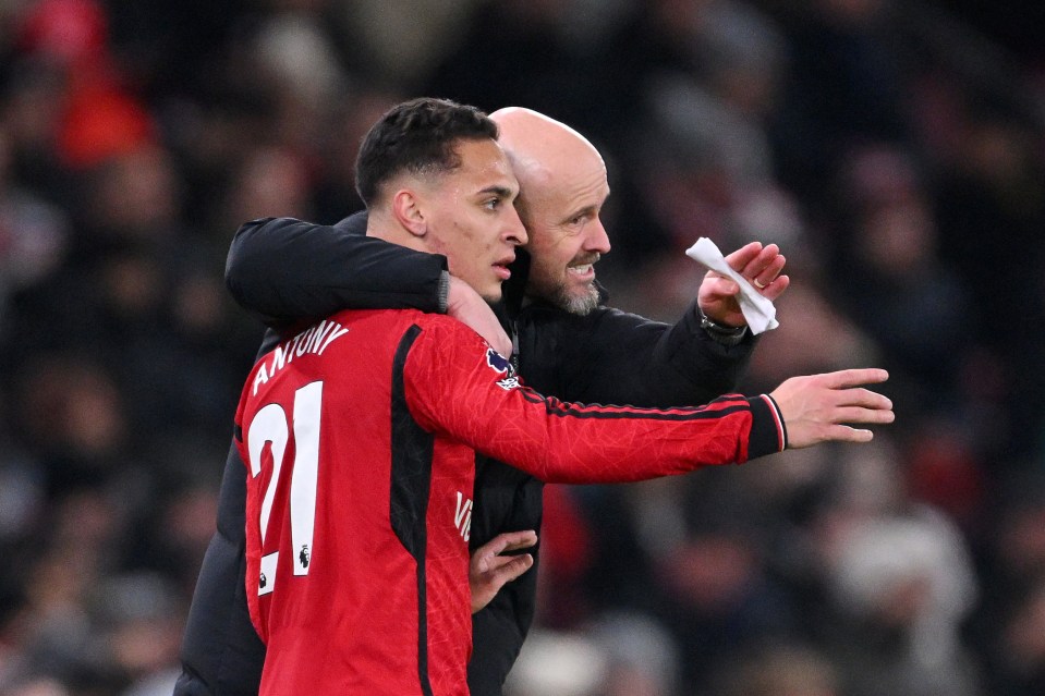 Manchester United's Antony receiving instructions from manager Erik ten Hag.