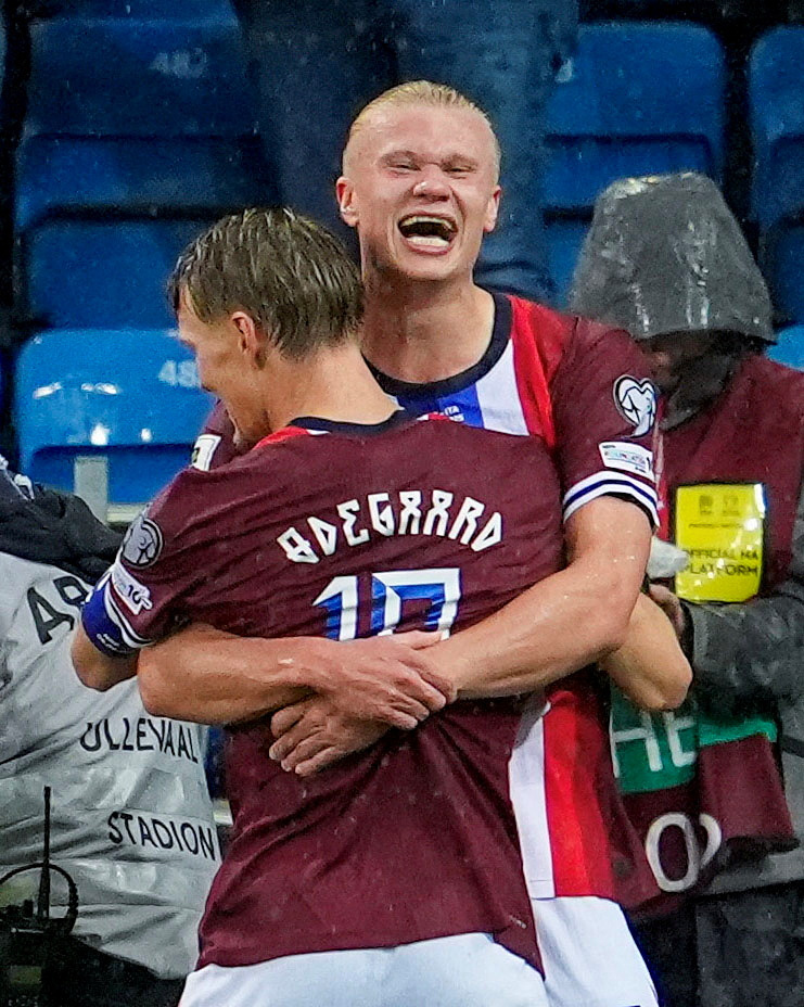 Erling Haaland and Martin Odegaard celebrating a goal.