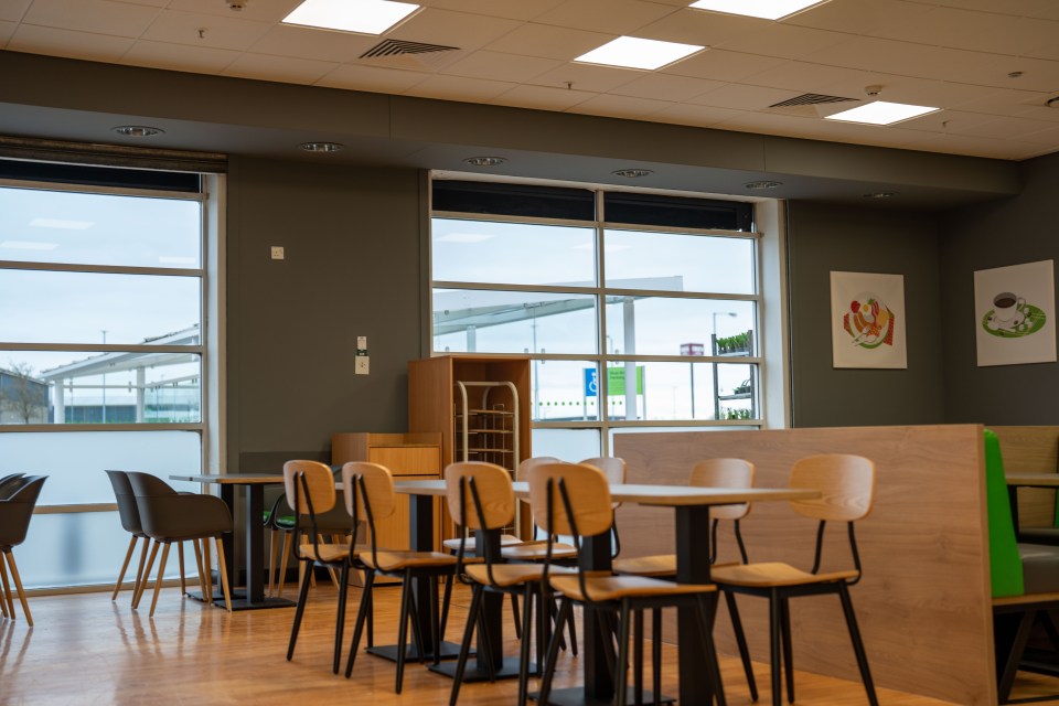 Empty cafe with tables and chairs.