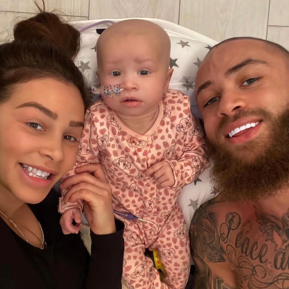 A family selfie with a baby girl.