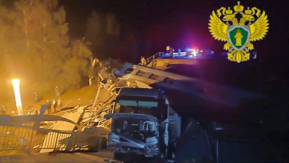 Rescue workers at the site of a train derailment in Bryansk, Russia.