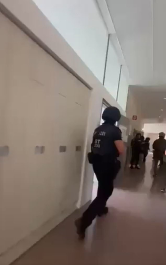 His mother immediately notified police after opening his video, but it was too late. Pictured: A grab from a chilling video circulating online that shows the moment gunshots rang out around the BORG Dreierschuetzengasse high school