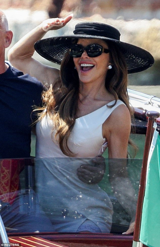 Lauren Sanchez was spotted this morning in a figure-hugging white mini dress that showcased her enviably toned arms. The 55-year-old newlywed, who was all smiles aboard a water taxi, accessorized with a wide-brimmed black hat, statement sunglasses and dazzling stud earrings