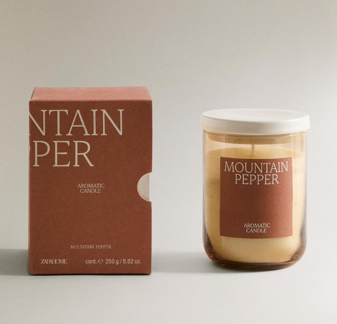 Mountain Pepper scented candle in glass jar with box.