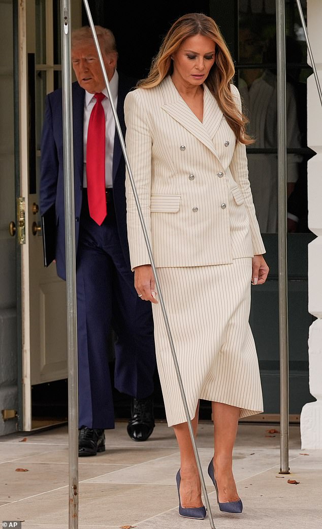 Melania Trump rarely puts a foot wrong when it comes to fashion and today was no different. The first lady, 55, commanded attention in a beige pinstripe skirt suit that she paired with pointed-toe grey stilettos. She styled her honey tresses in loose curls that she wore swept forward over one shoulder