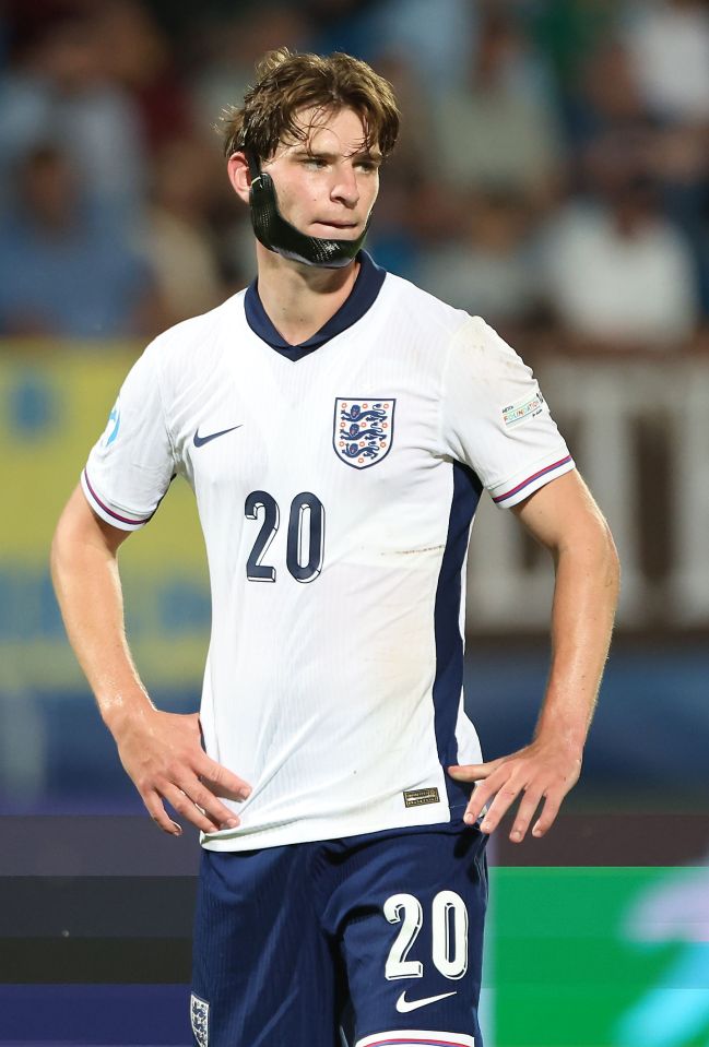 Alex Scott of England in a white jersey, number 20.