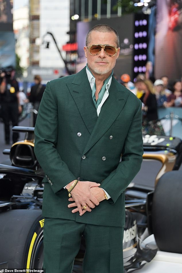 Brad Pitt looked dapper as he stepped out in a dark green suit for the European premiere of F1: The Movie in London on Monday