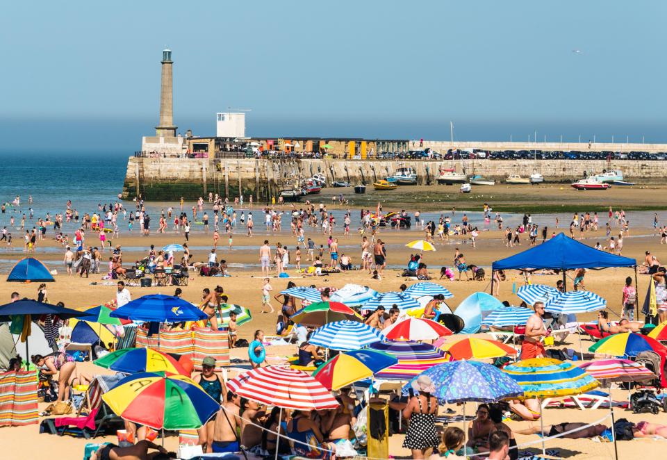 Crowded Margate beach on a summer day.