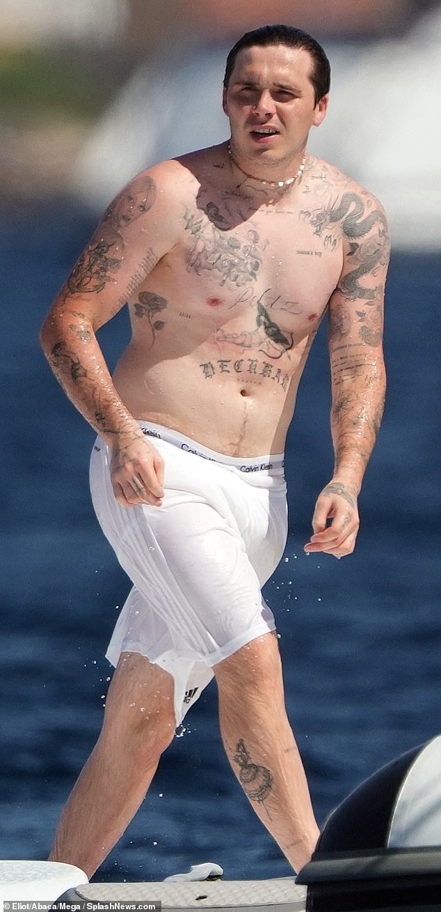 Brooklyn Beckham on holiday in Saint-Tropez, with his 'mamma's boy' tattoo on show over his heart