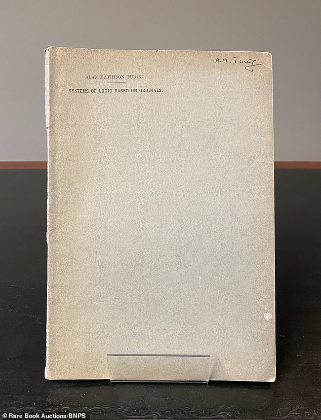 A cache of papers found in a loft and almost shredded sold for £465,500 at auction today after it was realised to be the pioneering work of Alan Turing (pictured: his personal signed copy of his 1938 PhD dissertation, 'Systems of Logic Based on Ordinals', that sold for £110,500)