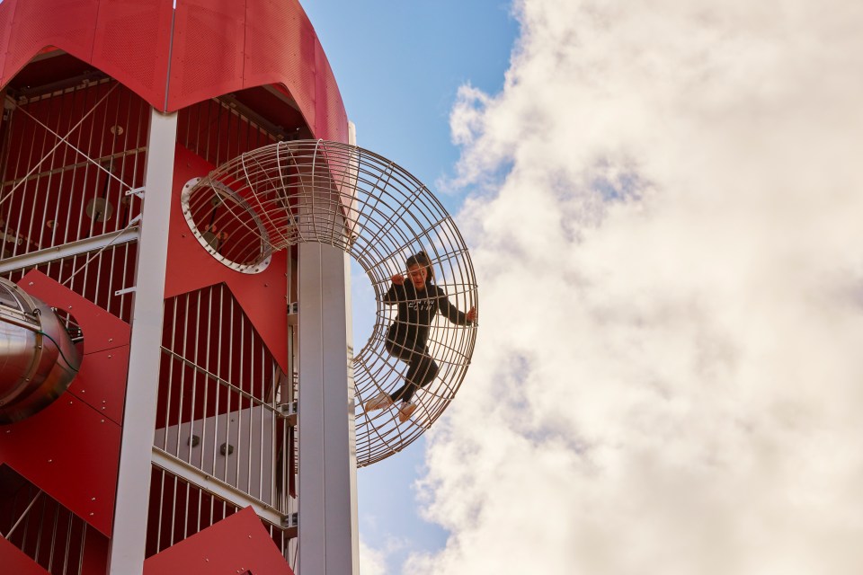 Child playing on a playground climbing structure.