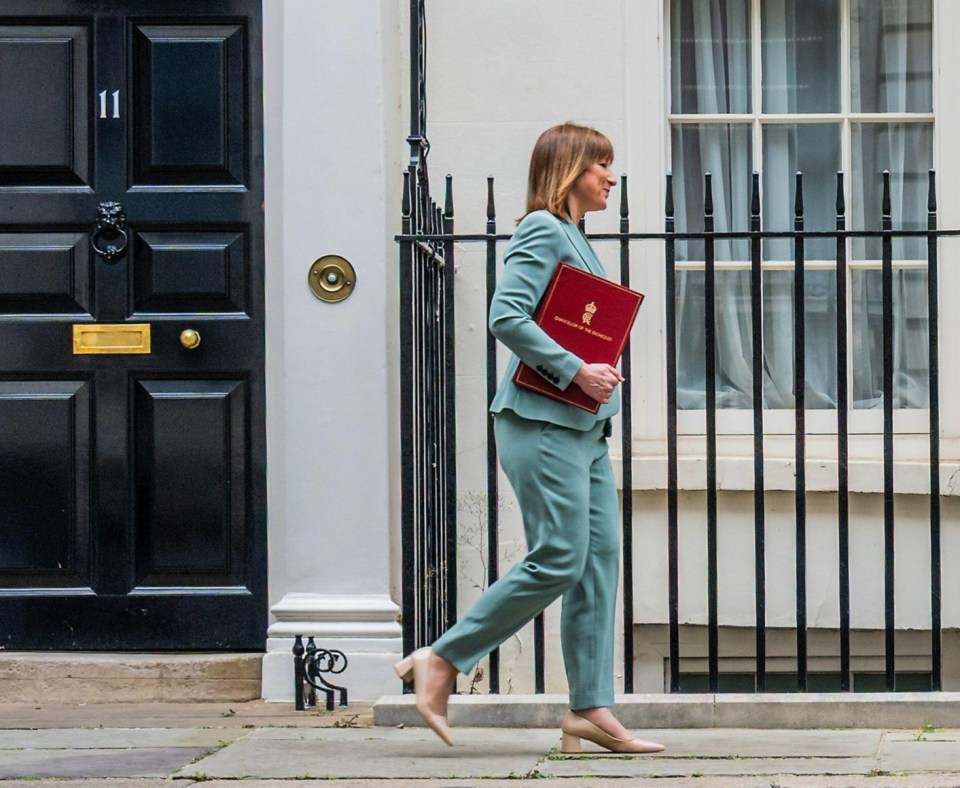 Rachel Reeves, Chancellor of the Exchequer, leaving Downing Street with a red document.
