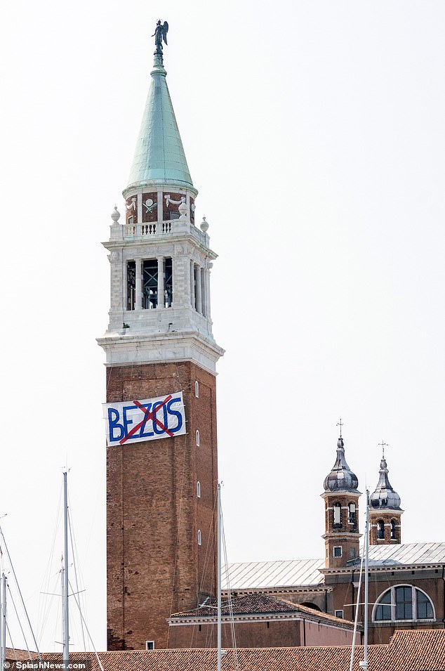 Activists have put up banners around Venice including the Giorgio Bell Tower denouncing the ceremony, which is said to be costing £7million