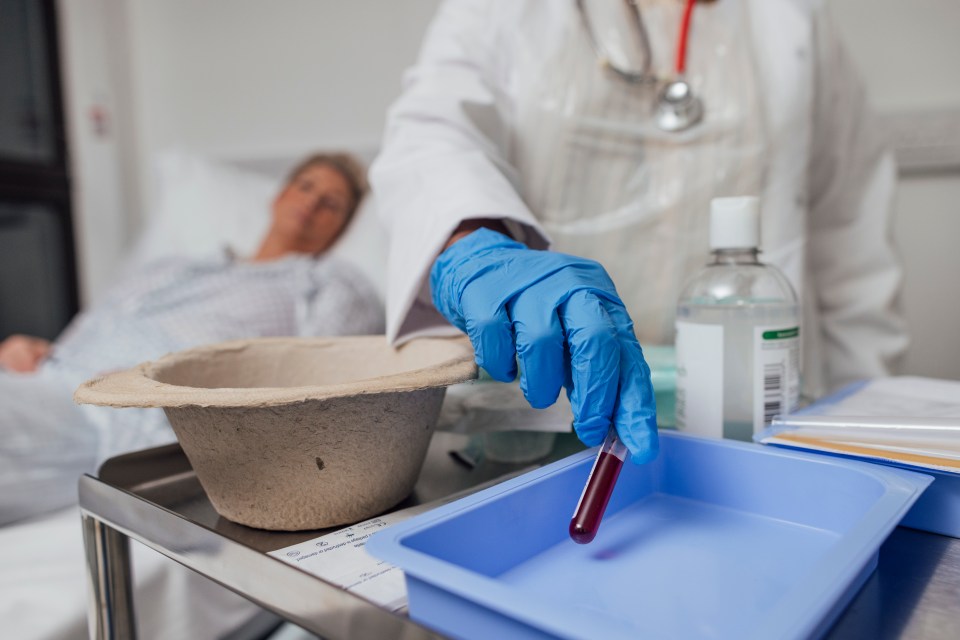 A close up of a female nurses hand taking a blood sample from a woman who is undergoing treatment for breast cancer. She is having her bloods taken to monitor her levels during treatment she can be seen in the background.</p>
<p>Videos are available for this scenario