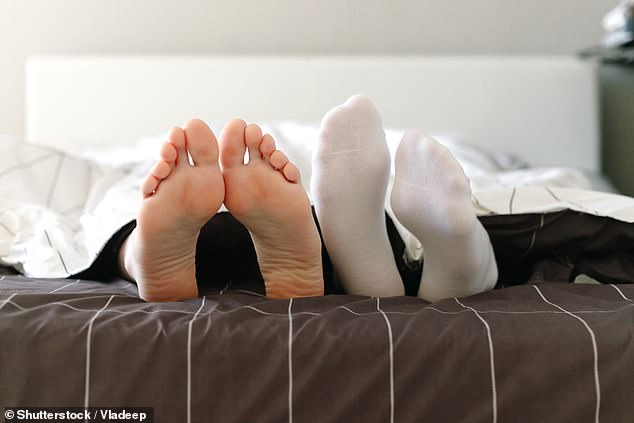 Scientists have revealed an unusual hack to help you fall asleep in the heat - putting on a pair of socks (stock image)