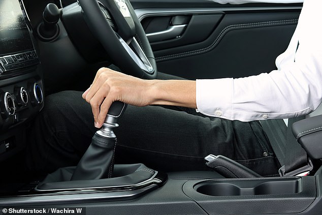 Ford Motor is recalling 197,432 vehicles in the US (File image of a man in a car)