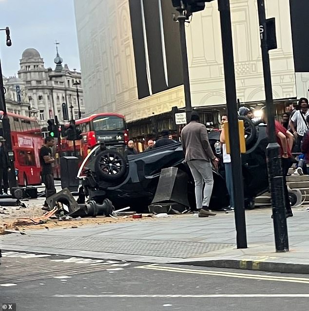 Photos show police tape sealing off roads and the crash scene where the heavily damaged vehicle is seen on its roof