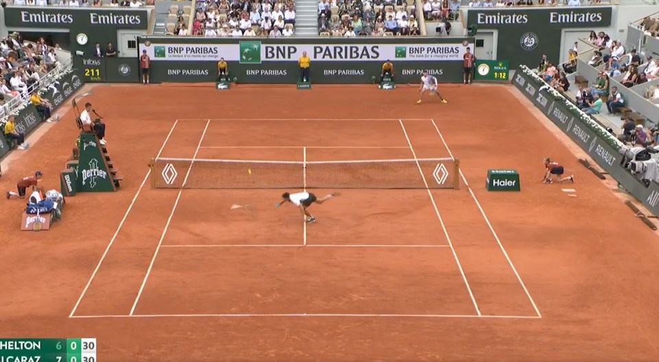 Tennis match in progress.
