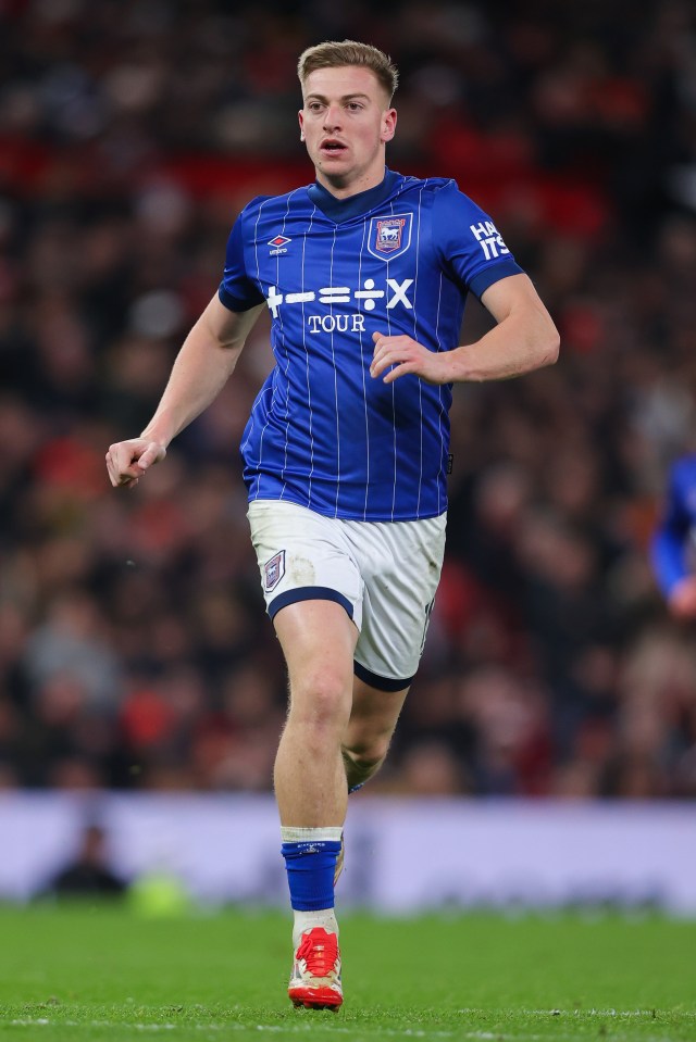 Liam Delap of Ipswich Town running on a soccer field.