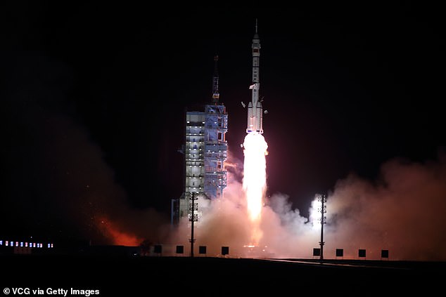 China has more than 500 satellites capable of intelligence, surveillance and reconnaissance (ISR), with 67 sent up in the last year alone (pictured: Long March-2F Y15 carrier rocket carrying the Shenzhou-15 spacecraft with three astronauts aboard)