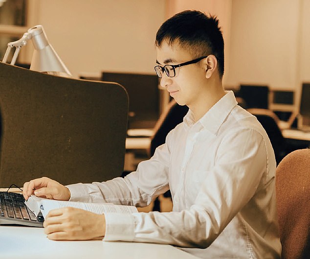 A photo of Zou where he poses as a diligent student