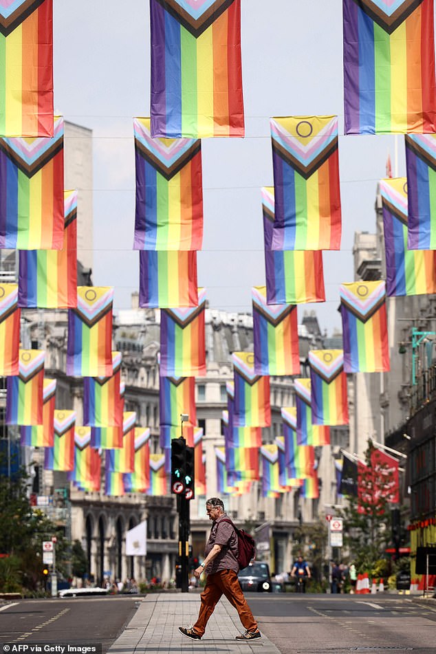 Progress Pride flags hang high on Regent Street in London on June 18, 2023