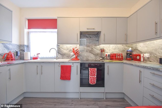 Elsewhere in the house is a spacious kitchen with ample storage space