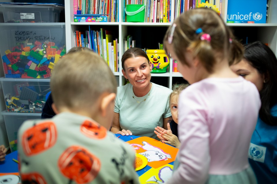 Coleen Rooney with Ukrainian children at a UNICEF workshop in Poland.