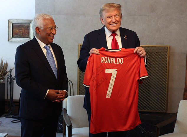 Donald Trump held up a shirt with a message for peace on it signed by Cristiano Ronaldo