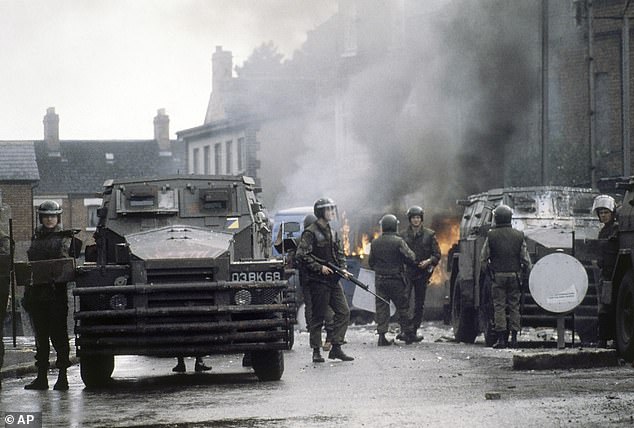 British troops guard a blazing barricade at a police station in Belfast in 1979. Now some veterans fear prosecution