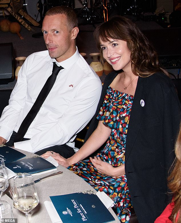 Dakota Johnson and Chris Martin have split after a near-eight year romance (Pictured in 2019)