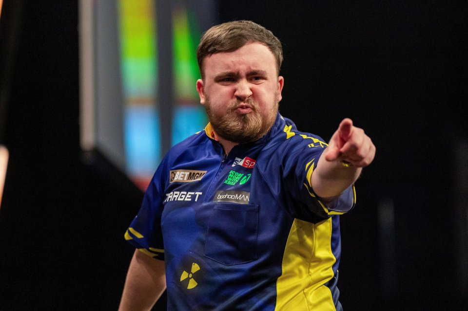 Luke Littler celebrates winning a leg at the BetMGM Premier League Darts.