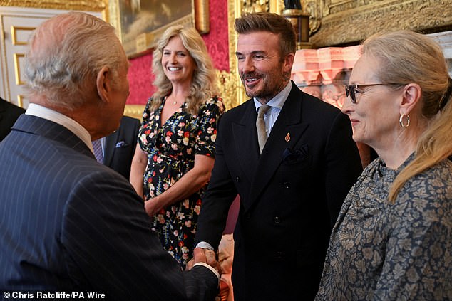 The former footballer, 50, declared himself 'immensely proud' on Friday as he finally received the honour after years of being snubbed (pictured)