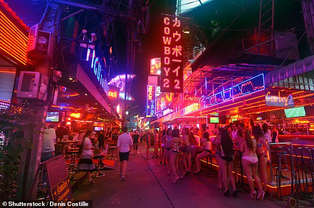 I once met a woman whose ageing father now lives in Pattaya with his 23-year-old 'fiancée', while his ex-wife is back home picking up the pieces of their shattered life together. (Pictured: a stock image of a red light district in Bangkok)