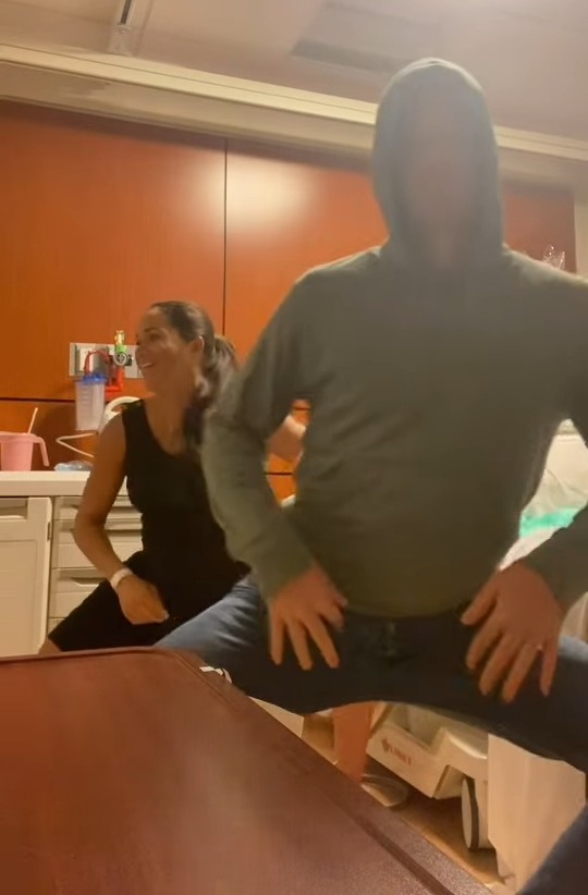 Meghan Markle and Prince Harry dancing in a hospital room.