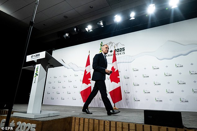 Canadian Prime Minister Mark Carney leaves the closing press conference at the end of the G7 summit he hosted in the mountain resort of Kananaskis, Alberta