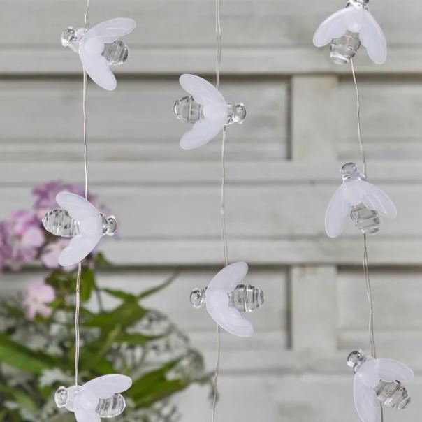 String of lights shaped like bees.