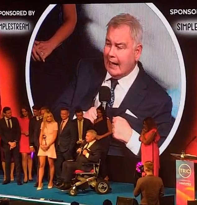 Eamonn Holmes faced a chorus of boos as he accepted the accolade for GB News at the TRIC Awards in his wheelchair on Tuesday evening