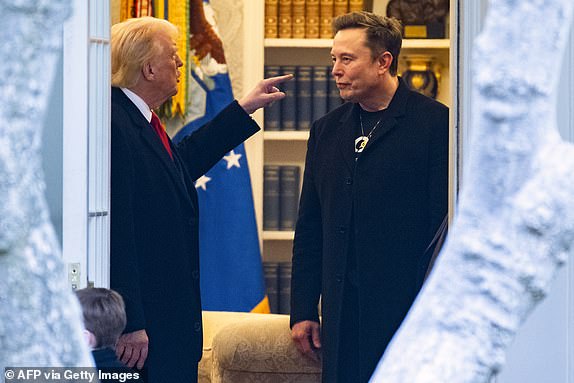 TOPSHOT - (FILES) US President Donald Trump and Elon Musk (R) speak before departing the White House on his way to his South Florida home in Mar-a-Lago in Florida on March 14, 2025. Donald Trump and Elon Musk's unlikely political marriage exploded in a fiery public divorce on June 5, 2025, with the US President threatening to strip the billionaire of his huge government contracts in revenge. (Photo by ROBERTO SCHMIDT / AFP) (Photo by ROBERTO SCHMIDT/AFP via Getty Images)