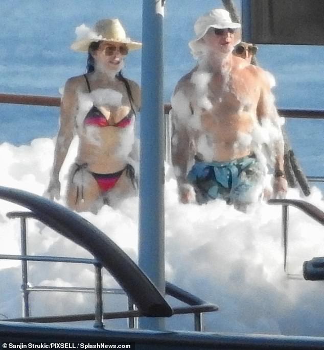 Jeff Bezos (R) Lauren Sanchez were pictured kicking off their opulent wedding-week festivities with a foam party on board a $500million superyacht on Sunday