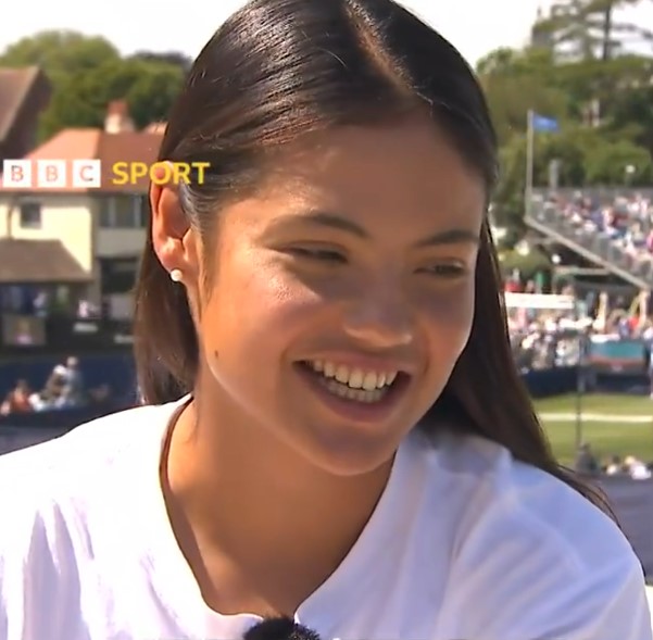 Close-up of a smiling woman.