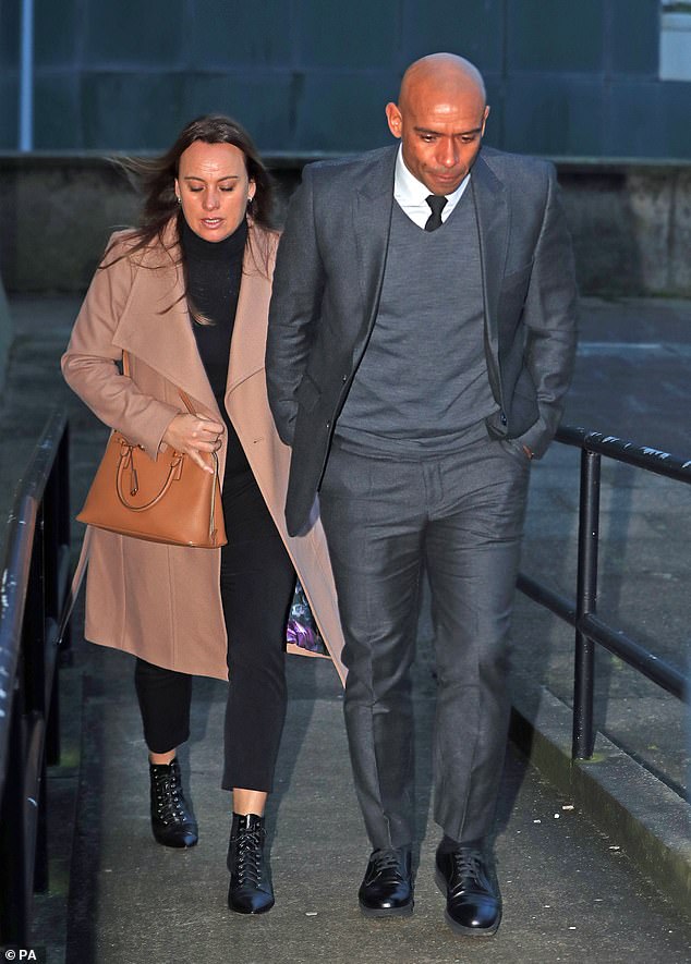 Former England star Trevor Sinclair (pictured arriving at court with his wife Natalie in 2017) has been made bankrupt after 'burying his head in the sand' over a £36,000 tax debt