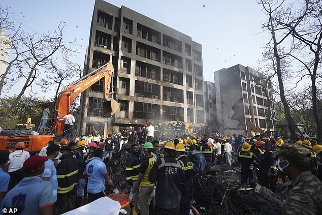 Search and rescue teams respond to the scene of a plane crash in Ahmedabad, India, Thursday, June 12, 2025