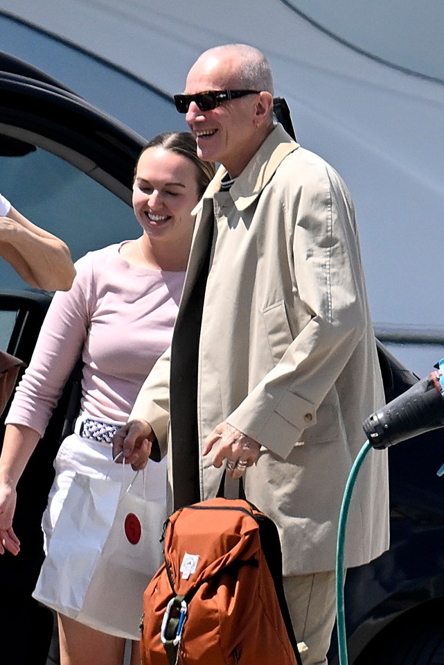 Daniel Day-Lewis and Rebecca Miller arriving by van and boarding a speedboat.