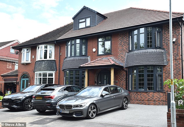 Aysha Khanom was fined nearly £2000 for a porch built without permission on Chadderton Hall Road in Oldham. Pictured: The modified porch