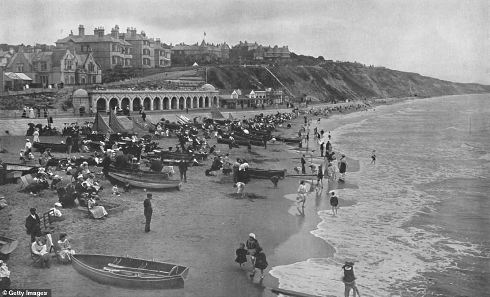 Taken at Bournemouth's East Sands Beach in around 1910, this photo shows the beach packed with holidaymakers. Bournemouth was recognised as a spa town soon after it was founded in the early 1800s