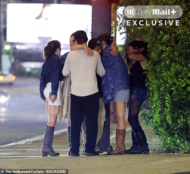 At one point, he was seen nearly falling onto them as the rest of his friends worriedly watched on