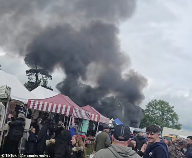 Huge crowds gathered to stare as smoke billowed across the fair that attracts thousands of gypsies from across Europe