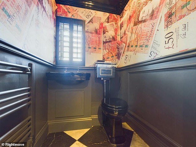 There is an unusual element on closer inspection: The bathroom contains £50 note wallpaper plastered all around the wall